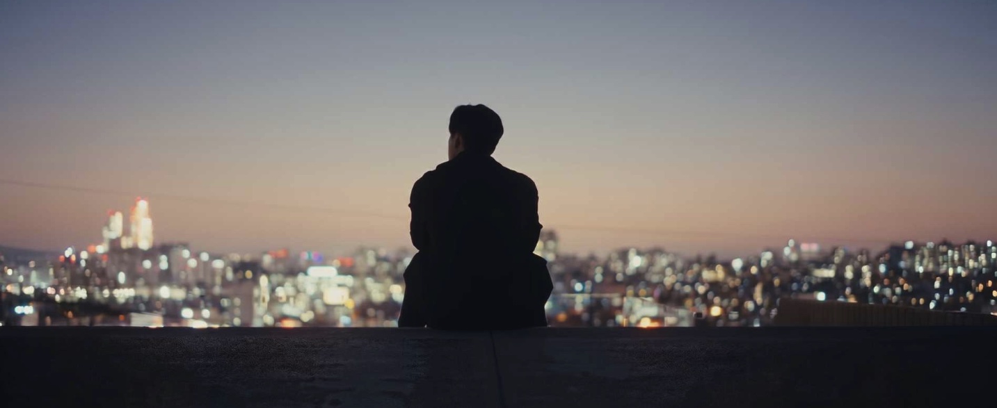 PGV founder Jon overlooking an Asian city skyline at dusk